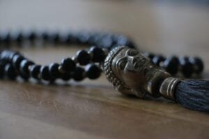 close up necklace with buddha head pendant